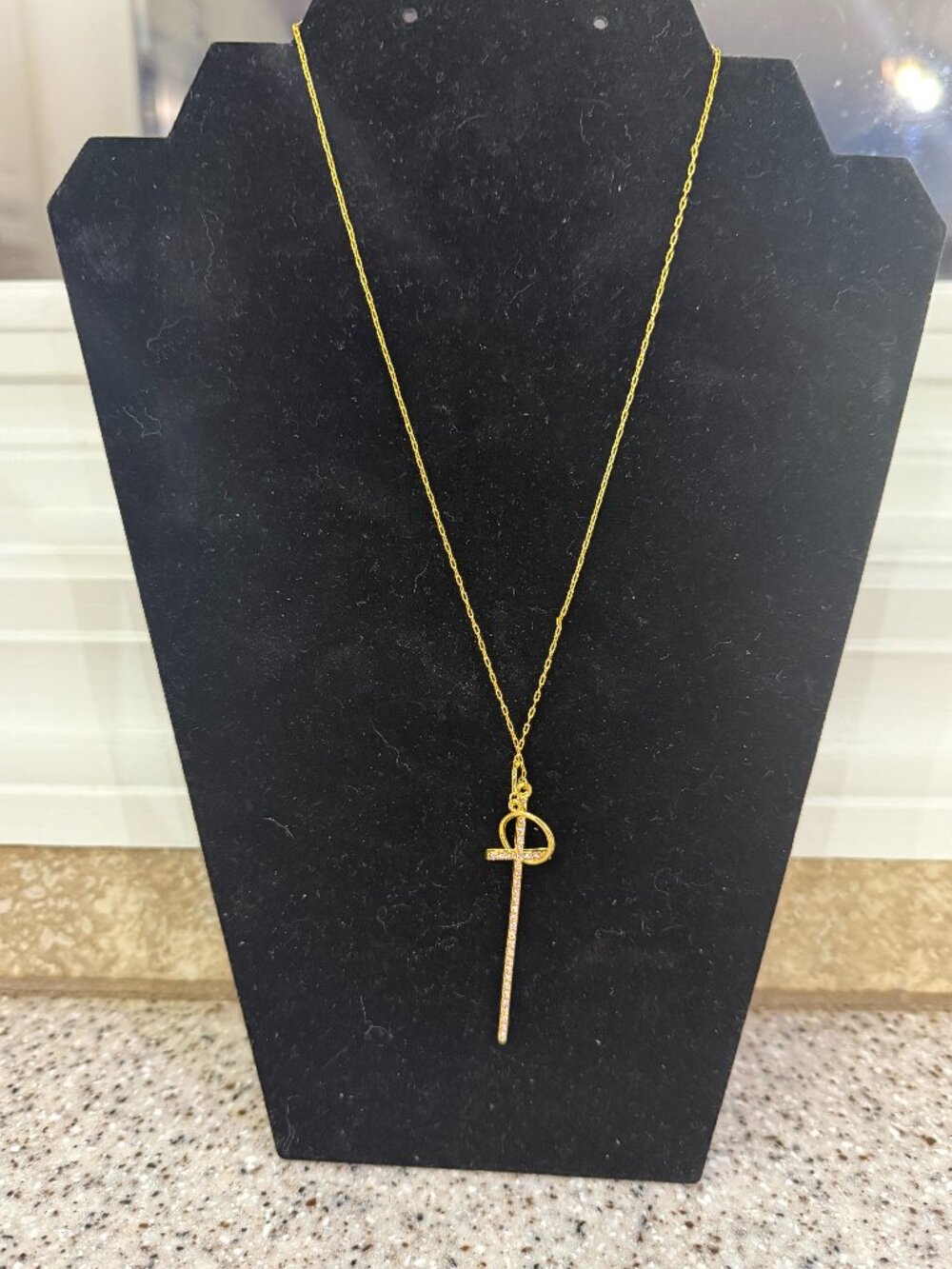 gold tone necklace with cross, pink stones, pendant